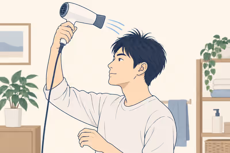 ドライヤーを髪から離して頭頂部へ風を送る男性の説明用イラスト